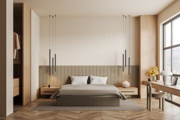 Cozy hotel bedroom interior with bed and workspace near window. Mock up wall