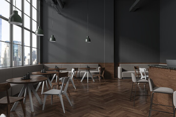 Gray cafe interior with sofas and round tables