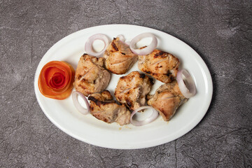 Chicken Reshmi tikka Kabab or malai boti seekh with onion served in dish isolated on background top view of bangladesh food