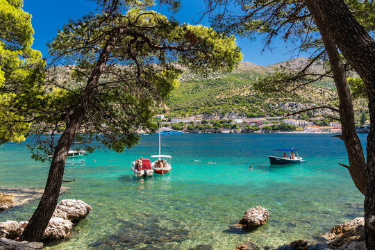 A beautiful bay at the Dalmatian Coastal line close to Dubrovnik with crystal clear and turquoise waters, creating a feeling of paradise

