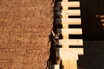 Closeup Hiwada buki roofing style traditional Japanese made from cedar or cypress layers bark...