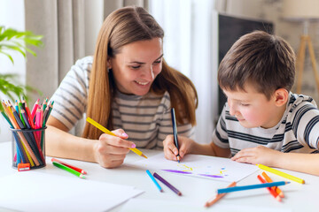 Mother and her son drawing together
