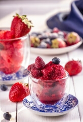 Berries sorbet in glass. Summer refreshing dessert of strawberry, raspberry, blueberry