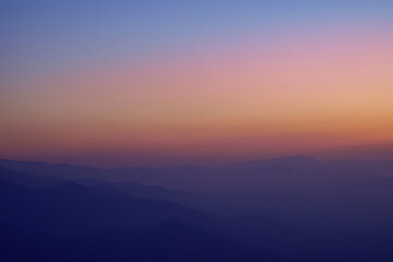 View of mountain ranges in the evening haze