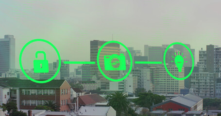Image of neon green network of digital icons against aerial view of cityscape