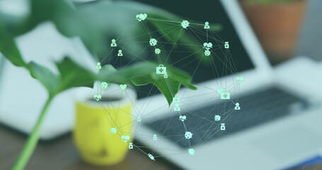 Image of network of connections over laptop