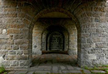 Stone archway in medieval castle. Ancient wall with arc of Akershus Castle in Oslo.