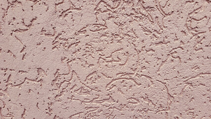 Pink decorative relief . Pink stucco wall. Pink background of the wall.