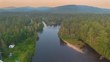 Fototapeta na wymiar Aerial view of a beautiful Canadian forest river in the province of Quebec