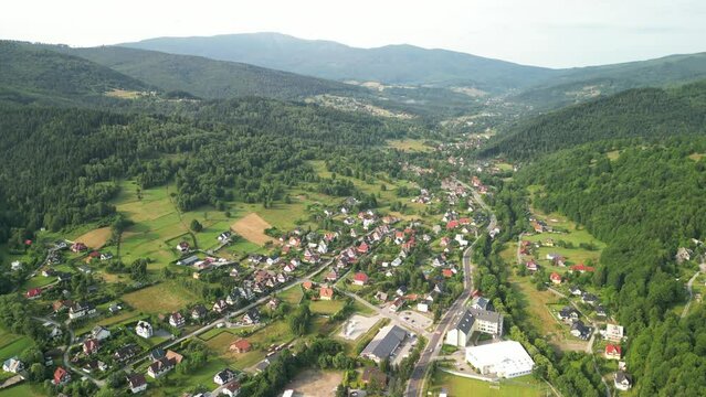 wide reveal shot of central part of Zawoja village with the Babia G&oacute;ra massif in the background, Lesser Poland, Poland