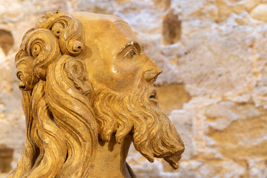 VALENCIA, SPAIN - FEBRUARY 14, 2022: The detail of statue of apostle from Puerta de los Apostloles gate in the Cathedral by Nocolas de Autun from first part of 14. cent..