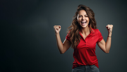 Fototapeta premium Young happy woman screaming cheering at soccer championship, wearing red jersey