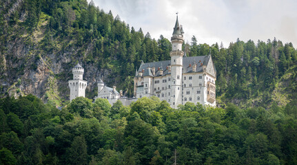 Fototapeta na wymiar fairytale castle on the hill near the mountains