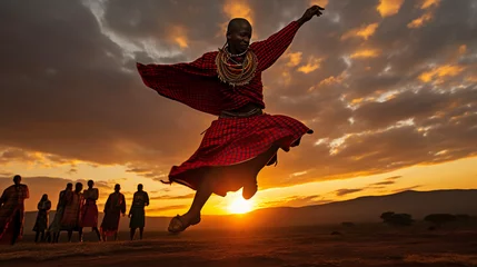 Fotobehang Maasai warrior dance, traditional red clothing, jumping high in the air, African Savannah background, wide - angle © Marco Attano