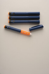 insulin pens on a light background