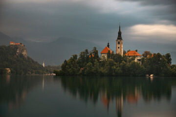 Amazing View On Bled Lake, Island,Church And Castle With Mountain Range (Stol, Vrtaca, Begunjscica)