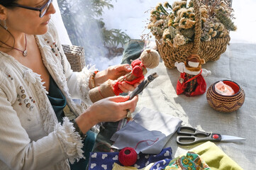 A woman make homemade dolls