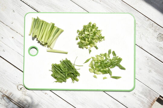 Handful Of Finely Chopped Green Onions On Striped Wooden Board Stock Photo,  Picture and Royalty Free Image. Image 40966933.