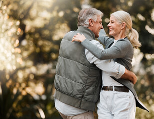Love, nature and senior happy couple dance, have fun and enjoy quality time together in park,...