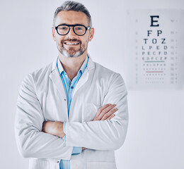 Portrait, eye exam and arms crossed with an optometrist man in his office for healthcare or vision...