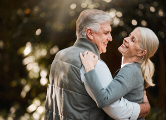 Smile, nature and senior couple dance, have fun and enjoy quality time together in woods, forest or romantic park date. Marriage, energy and elderly people care, support or bonding during retirement