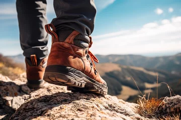 Papier Peint photo Montagnes Lifestyle concept for vacation or travel with closeup of trekking shoes hiking on top of natural mountain.
