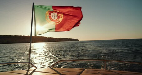Portugal flag waving in wind on boat.