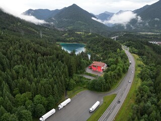 This drone photo shows a beatiful blue lake in the Austrian Alps near Fernpass