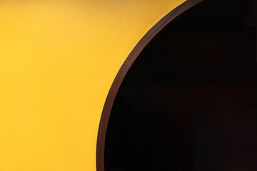 Yellow brick wall with a semicircular doorway