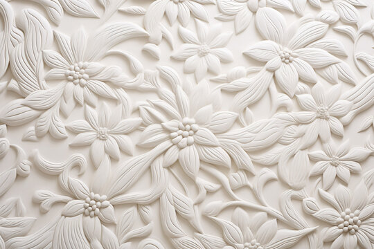 white wall plaster with floral molding, monochrome background