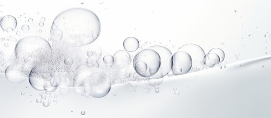Foamy texture of a skincare cleanser with soap bubbles on a white background and empty space