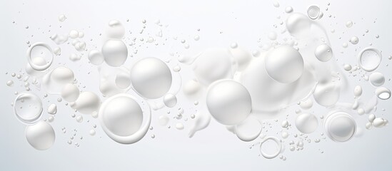 Foamy texture of a skincare cleanser with soap bubbles on a white background and empty space