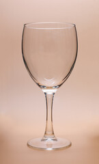 empty wine glass isolated on brown background