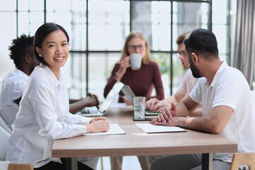 Group of happy business people in a meeting at office