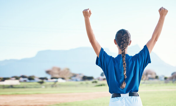 Woman, fist pump and winning, softball and athlete on outdoor pitch, celebration and success with sports. Back view, baseball player and yes, fitness and achievement, cheers and competition winner