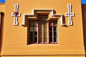 A central library in Cape Town window with a lgbtqia+ sticker.