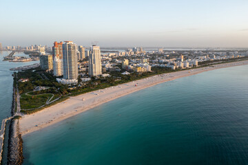 Aerial view of South Beach and South Pointe Park in Miami Beach, Florida at sunrise on calm clear summer morning.