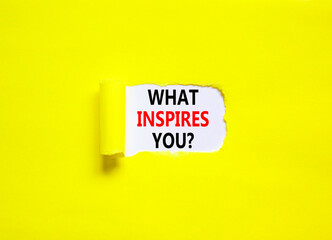 What inspires you symbol. Concept words What inspires you on beautiful white paper. Beautiful yellow background. Business motivational what inspires you concept. Copy space.