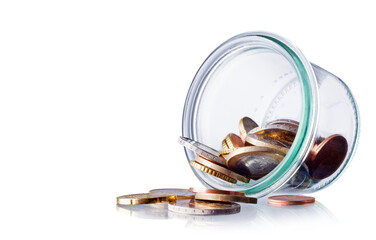 coins in a glass jar isolated