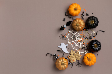 Halloween party decorations from pumpkins, bats, spider web and ghosts top view. Happy halloween...