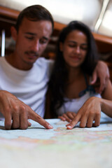 Fototapeta premium Vertical photo of a couple thinking about their next trip together