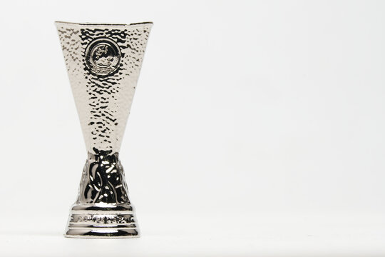 "Selangor, Malaysia- August 12, 2023: Selective focus picture part of UEFA Europa League replica miniature trophy on copyspace white background."