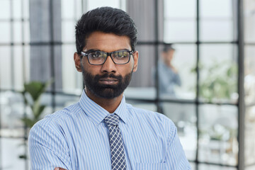 Close-up photo portrait of successful and happy businessman, male investor beard looking at camera