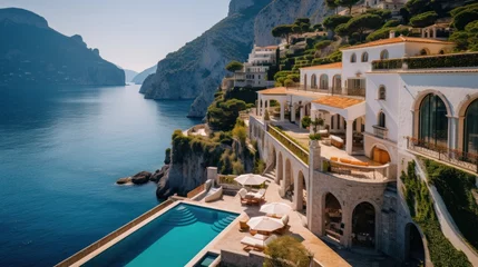 Fotobehang Exquisite villa perched on the stunning Amalfi Coast of Italy, offering unparalleled vistas of the glistening Mediterranean Sea and terraced cliffs © Damian Sobczyk