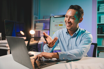 business man working late at night use laptop at desk Happy male portrait working IT, face and male...