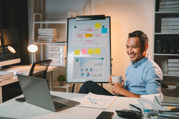 business man working late at night use laptop at desk Happy male portrait working IT, face and male...