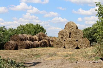 A large stack of hay bales
