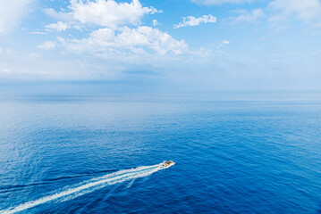 Outboard boat entering the blue waters of the Mediterranean, Granada coast.