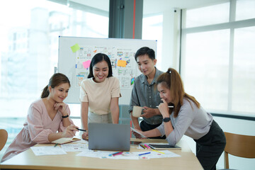 Group of asian creative teamwork discuss at business meeting for developing mobile phone app project, ux, ui start up, small business concept