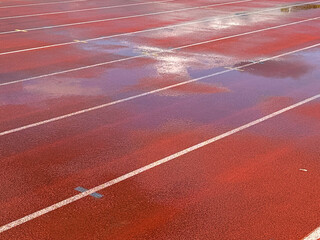Wet running track reflection clouds.